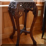 F31. Carved Chinese plant stand. 